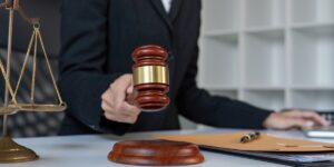 Lawyer in action a courtroom scene with gavel legal documents and scales of justice Lawyer in action a courtroom scene with gavel legal documents and scales of justice